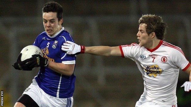 Cavan's Gerry Smith is challenged by Kieran McGeary of Tyrone