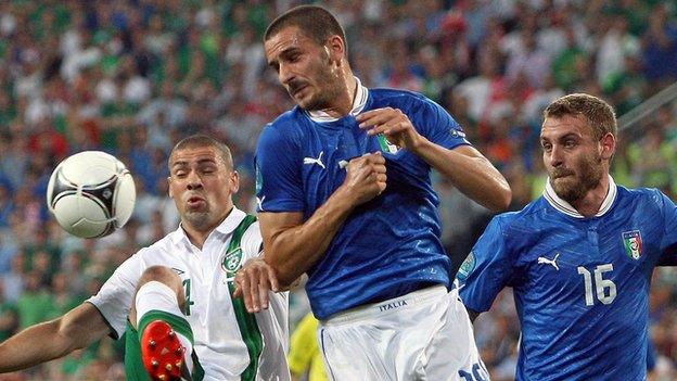 Jonathan Walters battles with Leonardo Bonucci during the Euro 2012 game between the countries