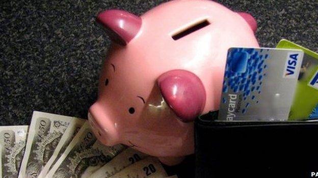 Piggy bank with notes and cards