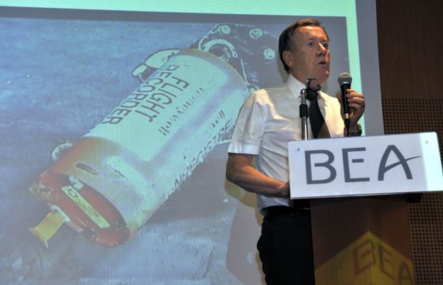 Alain Bouillard, investigator-in-charge of flight Air France 447 safety investigation from French agency Bureau of Enquiry and Analysis for Civil Aviation Safety (BEA), speaks during a press conference focused on the AF447 Rio-Paris plane flight black boxes (screen), on May 12, 2011