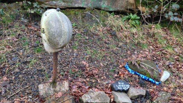 The entrance to the mine has now been blocked by a mound of rubble with the helmet is the only clue it exists