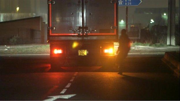 Migrant running towards truck