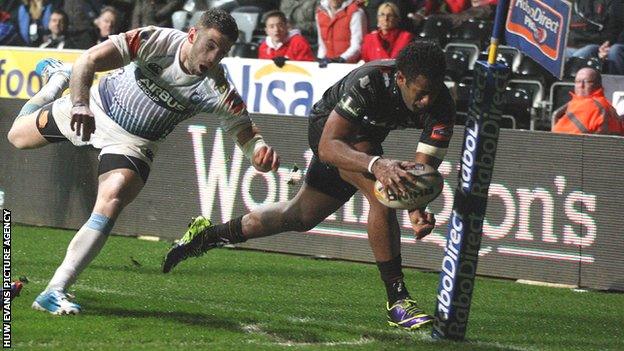 Aisea Natoga crosses for his third try against Cardiff Blues with Alex Cuthbert trailing in his wake