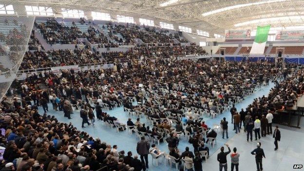 Algerians attend a gathering organised by political parties calling for the boycott of the 17 April presidential elections