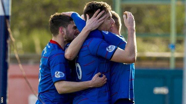 Billy McKay celebrates with his Inverness team-mates after opening the scoring against Partick Thistle