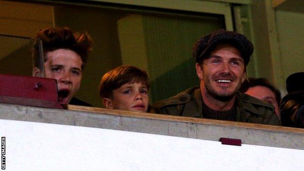 David Beckham watching from the stands as Wayne Rooney scores