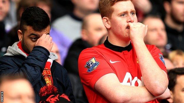 Manchester United fans look dejected