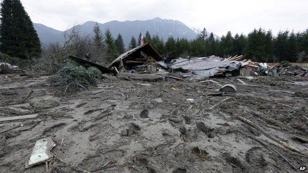 Footprints from searchers remain in mud at the edge of a deadly mudslide in Oso, Washington, on 25 March 2014