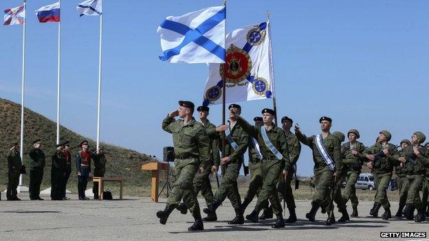 Russian marines march at a military base in Sevastopol, Crimea, on 24 March 2014