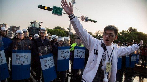 Riot police clash with student protesters outside the Executive Yuan, a branch of government in charge of administrative affairs for all of Taiwan on 24 March 2014 in Taipei, Taiwan