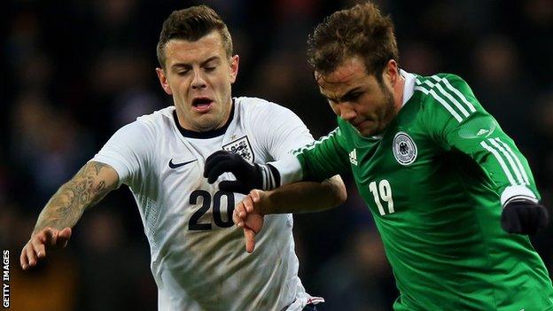 England's Jack Wilshere battles for possession with Mario Gotze of Germany at Wembley in November 2013