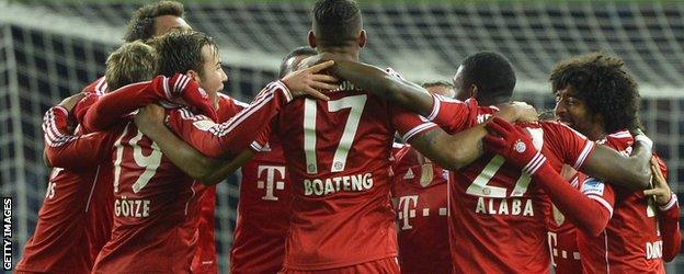 Bayern Munich's players celebrate winning the Bundesliga title