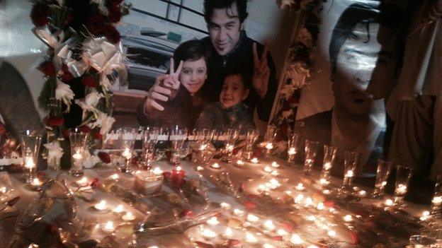 Journalists remember Sardar Ahmad and his family at a candlelight vigil in Kabul