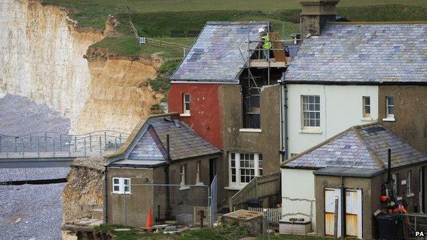 Engineer working at cottage at Birling Gap