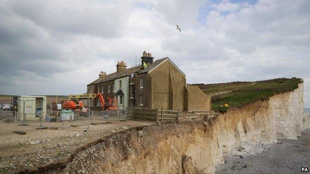 Engineer working at cottage at Birling Gap