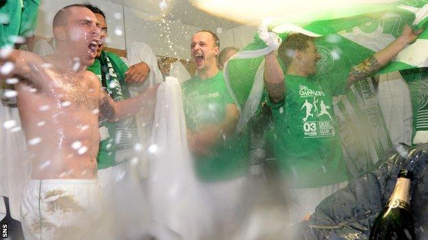 Celtic players celebrate in the dressing-room