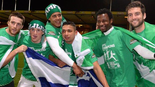 Celtic players celebrate on the Firhill pitch