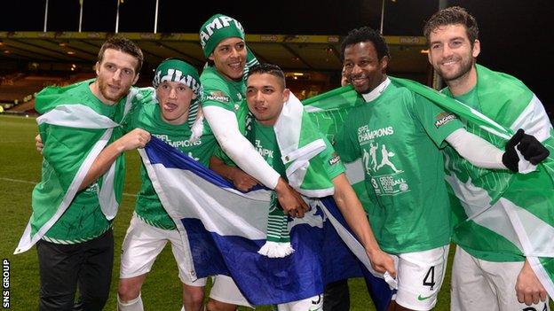 Celtic players celebrate their title success at an empty Firhill