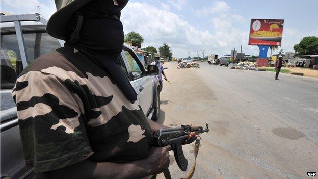 Masked militiamen in Abidjan