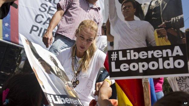 Lilian Tintori, the wife of jailed opposition leader Leopoldo Lopez, greets supporters during a demonstration marking one month of his detention on 18 March, 2014