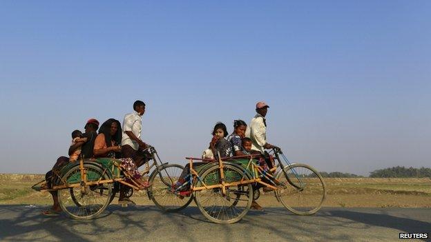 Rohingya families are seen at the Rohingya refugee camp outside Sittwe, capital of Rakhine state in Myanmar, on 29 March 2014