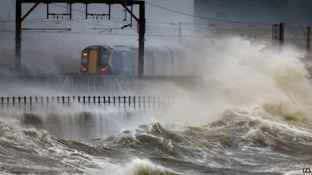 A train passes through the coast at Saltcoats in Scotland