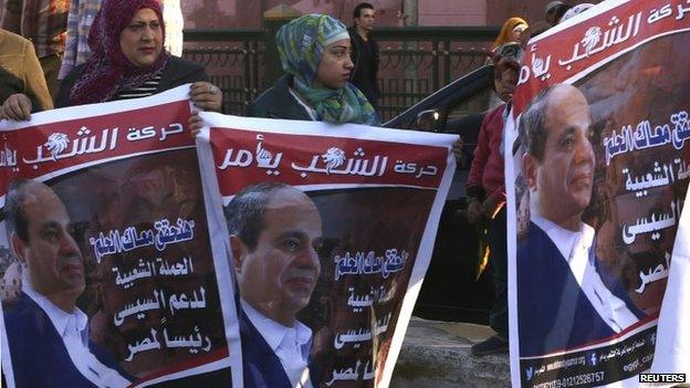 Supporters of Egypt"s former army chief Field Marshal Abdel Fattah al-Sisi celebrate the announcement of his candidacy