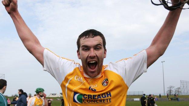 Antrim goal-scorer Conor Carson celebrates after the final whistle in Ballycastle