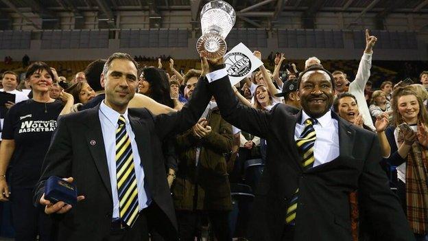 Worcester coach Paul James (right) lifts the BBL Trophy after beating Glasgow.