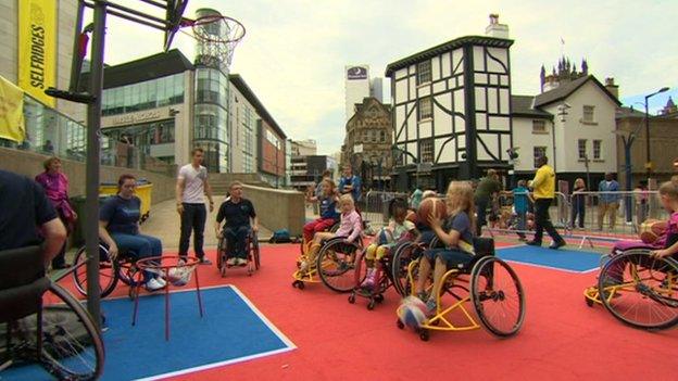 Children in wheelchair playing basketball