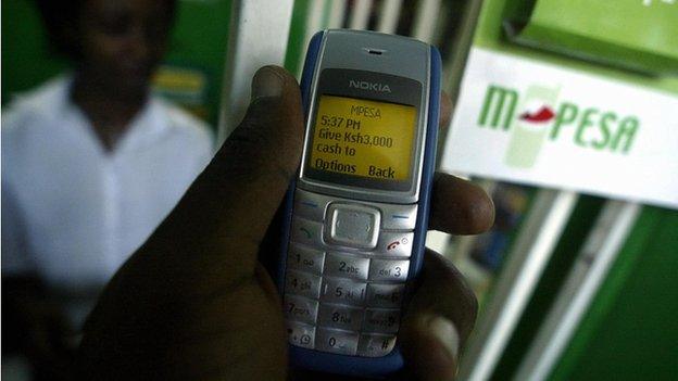 Man uses M-Pesa in Nairobi