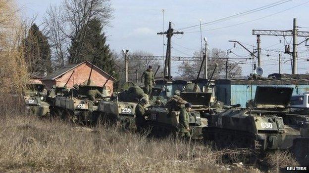 Russian infantry fighting vehicles on train carriages in the western Russian town of Vesyolaya Lopan (12 March 2014)