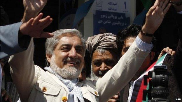 Afghan presidential candidate Abdullah Abdullah waves to supporters at a election rally in Kandahar on March 30, 2014.