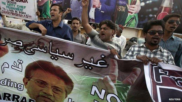 Supporters of former President Pervez Musharraf, head of the All Pakistan Muslim League (APML) political party, chant slogans during a protest demanding a fair trial for him in Karachi March 30, 2014.