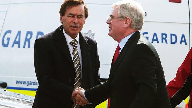 Justice Minster Alan Shatter (left) greets Labour leader and Irish Deputy Prime Minister Eamon Gilmore