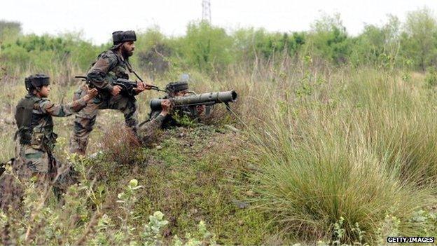 Indian army jawans taking position during an encounter with terrorists at Janglote village on 28 March, 2014 in Kathua, about 80 km from Jammu, India