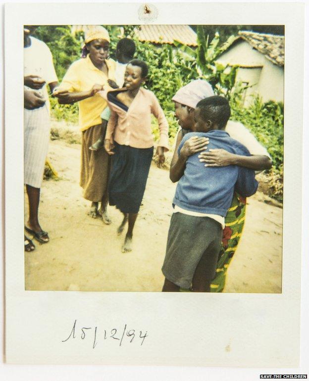 A Polaroid photo of the moment of reunification between separated children and their family.