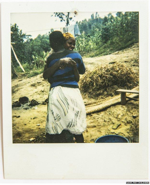 A Polaroid photo of the moment of reunification between separated children and their family.