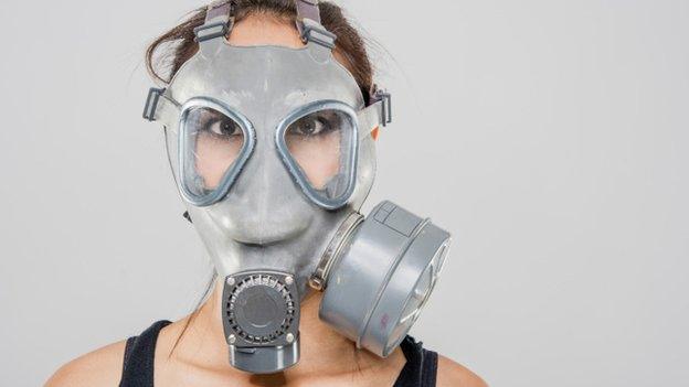 Woman in gas mask