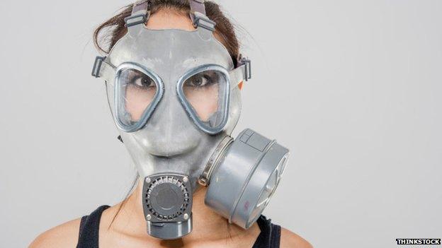 Woman in gas mask