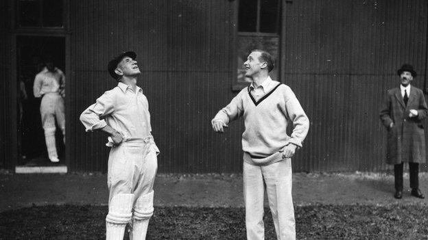 Cricketers toss a coin