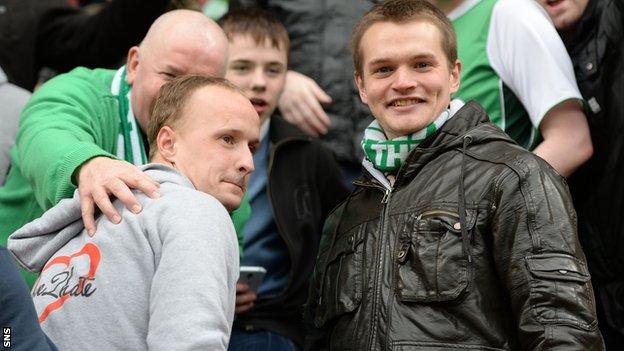 Celtic striker Leigh Griffiths (left) joins Hibs fans at Sunday's Edinburgh derby