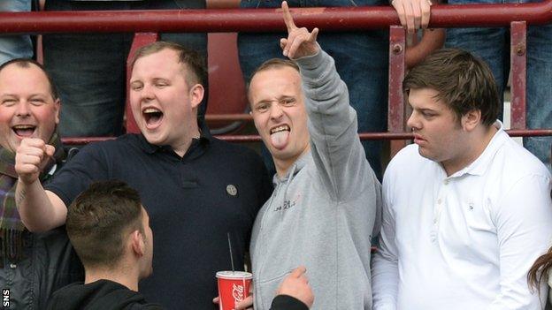 Celtic striker Leigh Griffiths (centre) joins Hibs fans at Sunday's Edinburgh derby