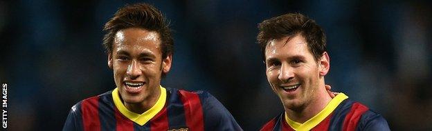 Neymar (L) and Lionel Messi of Barcelona walk off in good spirits following their team's victory at the end of the UEFA Champions League Round of 16 first leg.