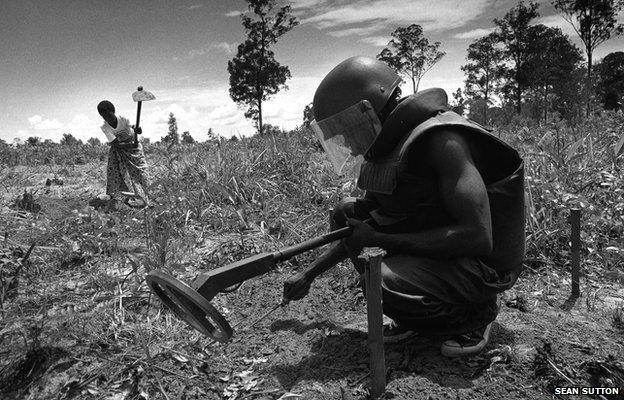 Clearing landmines, Angola, 1995