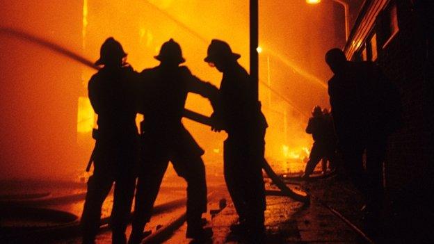 Firefighters dealing with a fire during the Brixton Riots