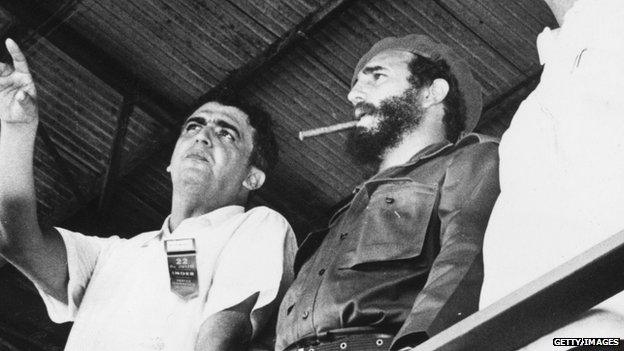 Fidel Castro watches a gymnastics display in Havana in 1962