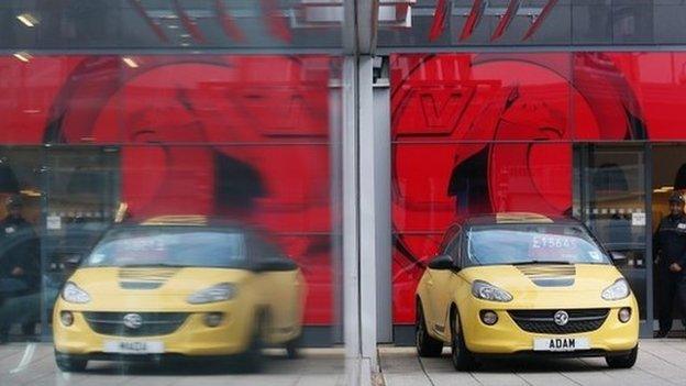 Cars are displayed for sale on the forecourt of a Vauxhall dealership on January 8, 2014 in London