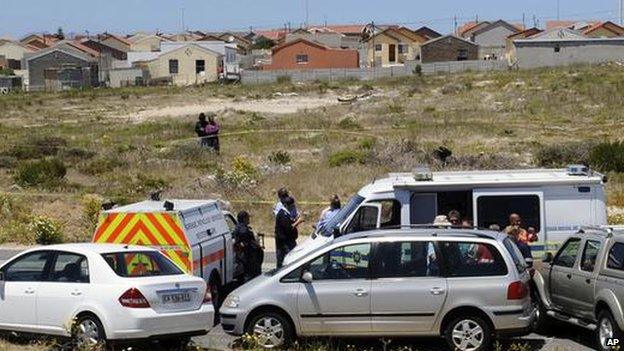 South African police stand by the car (centre) that the body of Anni Dewani was found in the township of Khayelitsha, on the outskirts of the city of Cape Town, South Africa - 14 November 2010