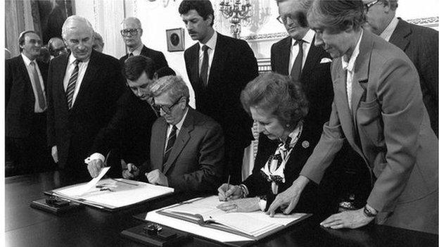 Margaret Thatcher and Garret Fitzgerald signing the Anglo-Irish agreement in 1985